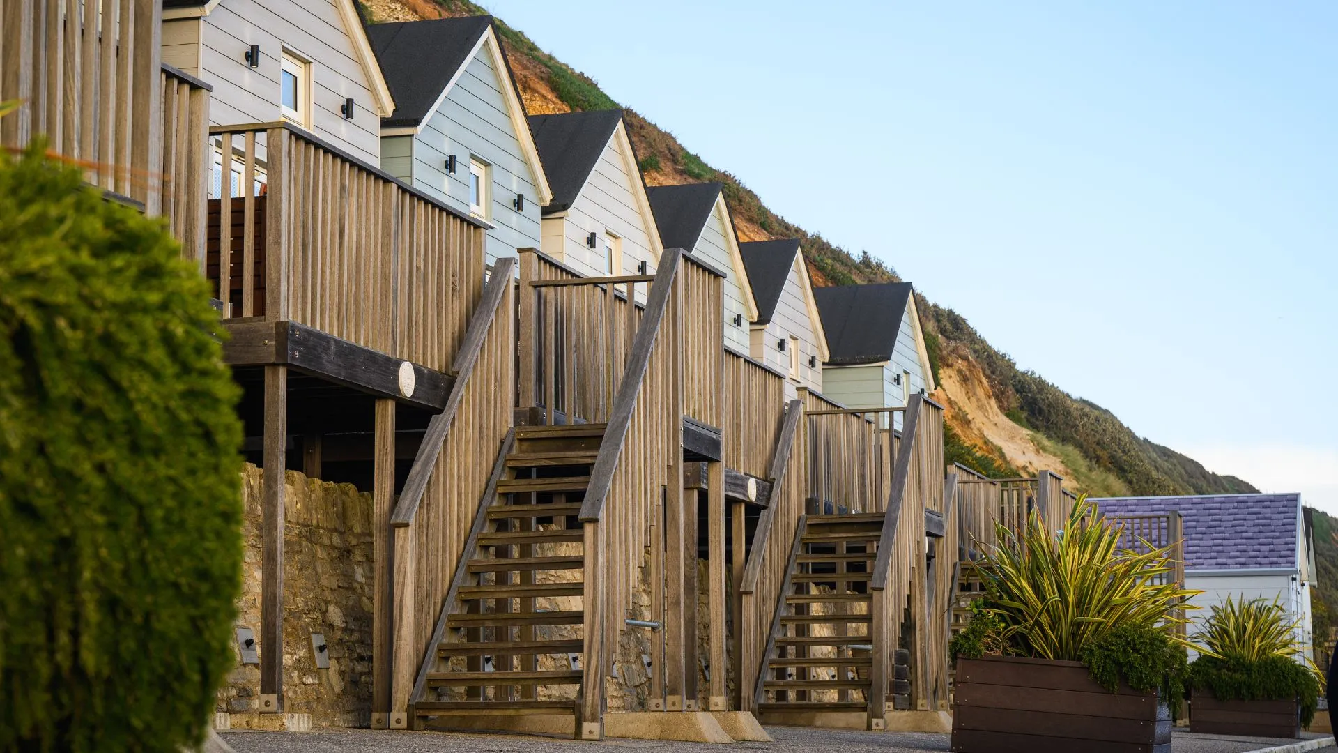 A row of Beach Lodges including staircase on an autumn morning