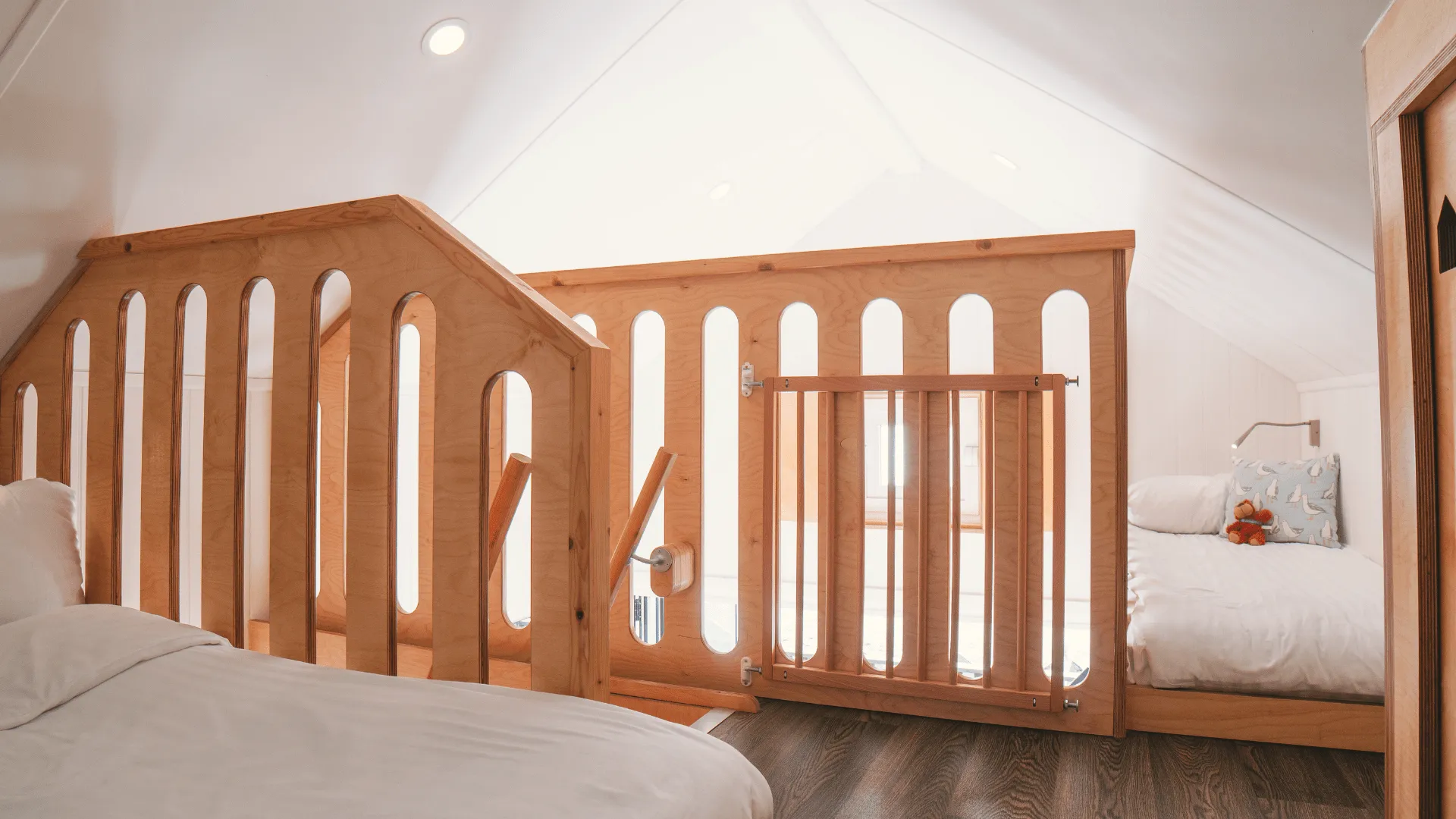 First Floor sleeping area with wooden staircase and railings