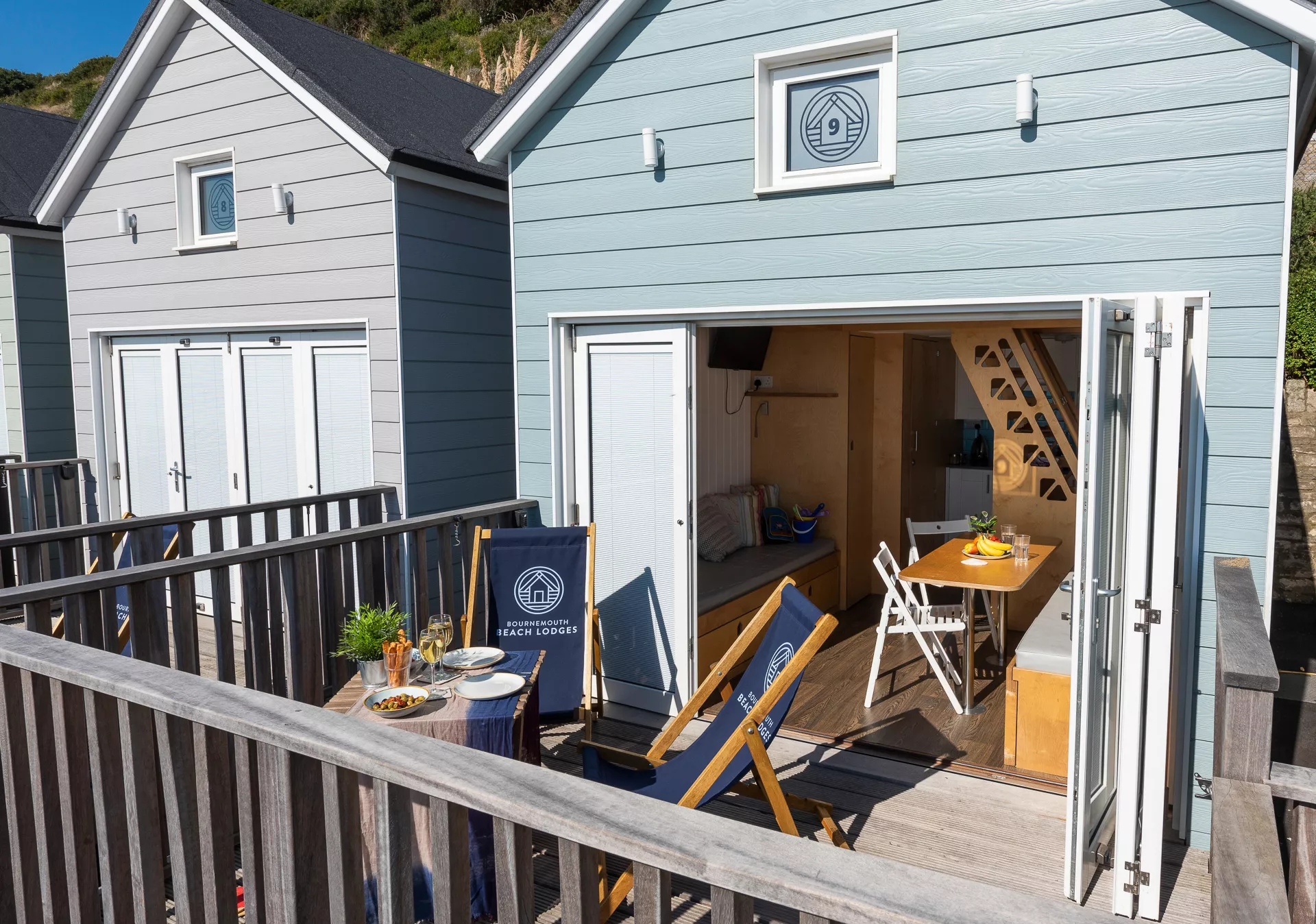 Open Beach Lodge with terrace table and deckchairs