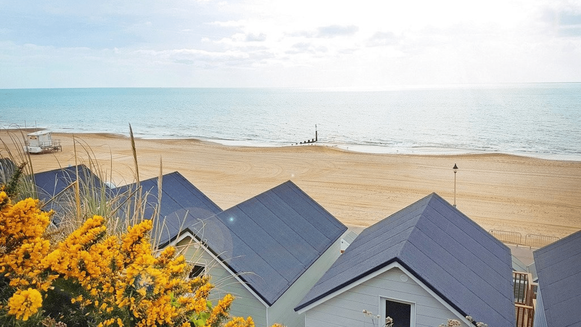 Row of Beach Lodges overlooking clean and sandy beach
