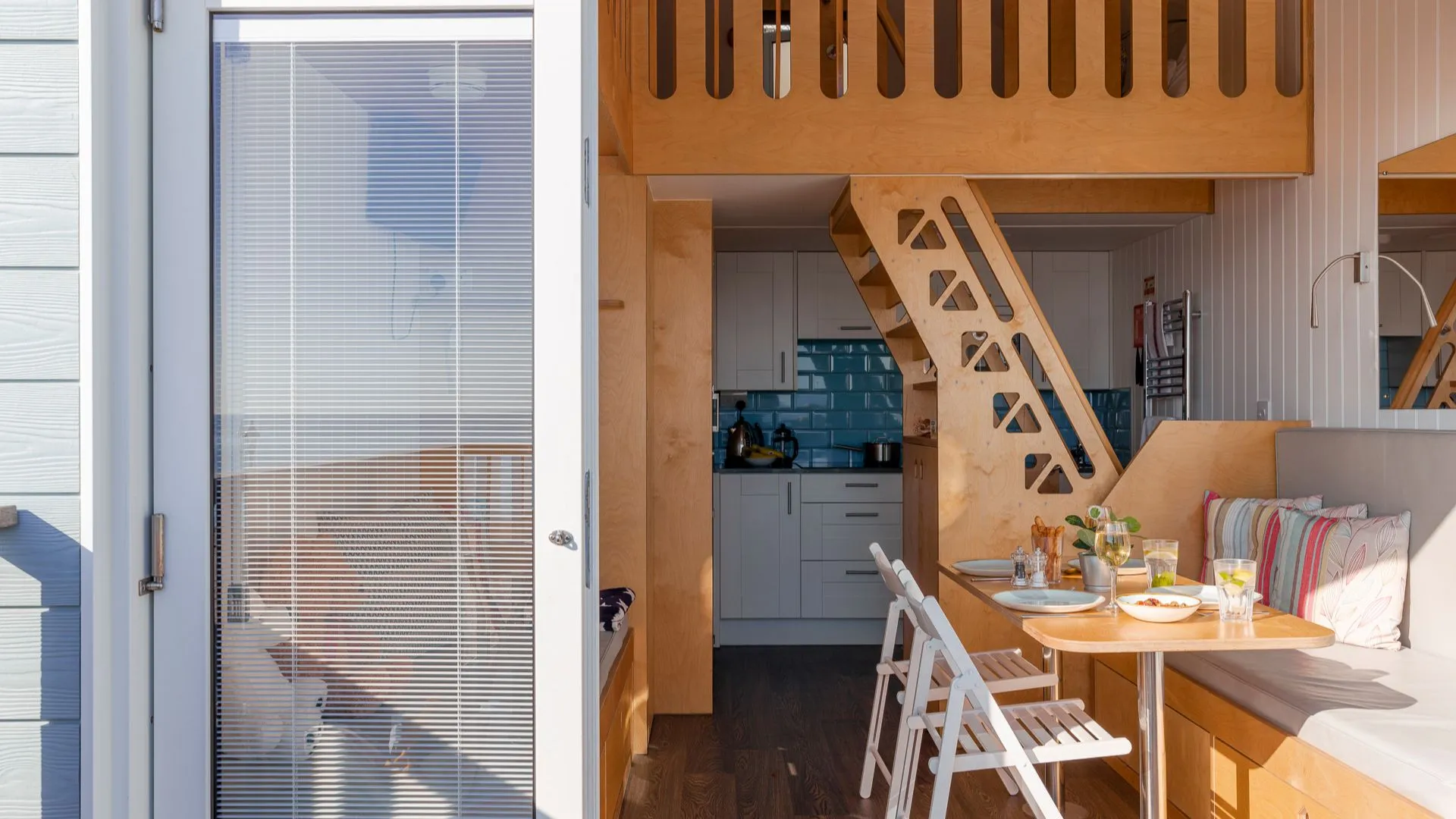 Looking into a beach lodge at the dining and kitchen area