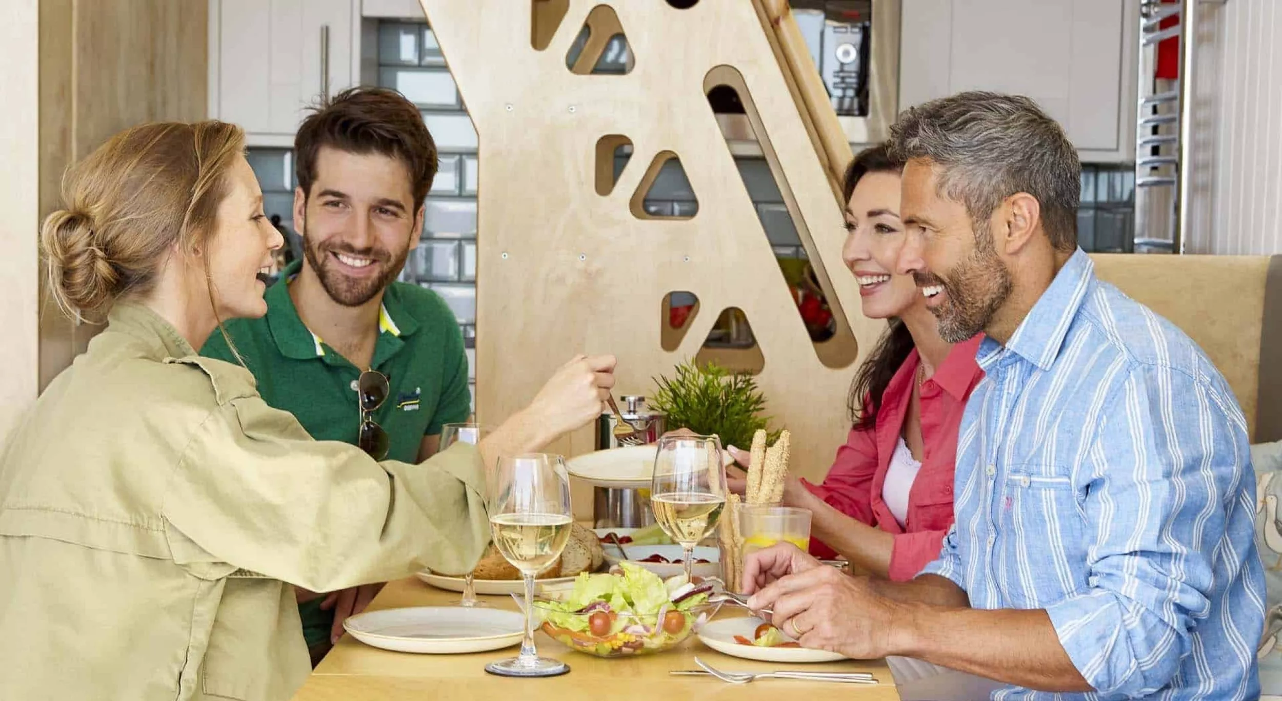 Family friends enjoying delicious lunch in their lodge