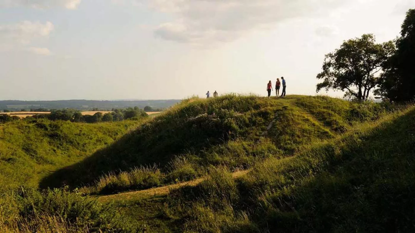 Visitors enjoying the views of badbury rings in Dorset