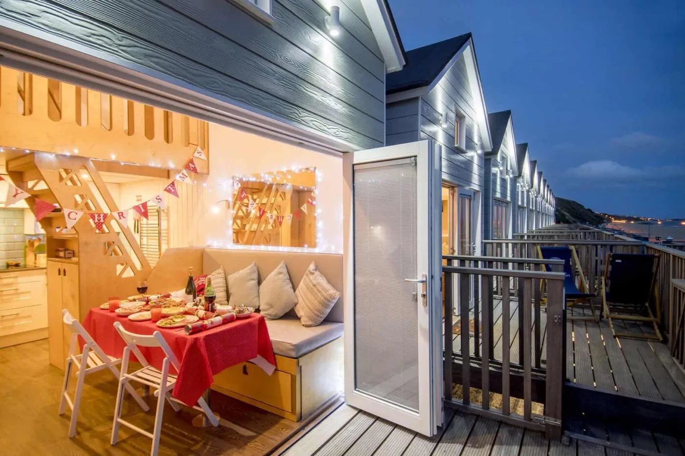 Beach lodge decked out with Christmas decorations at dusk