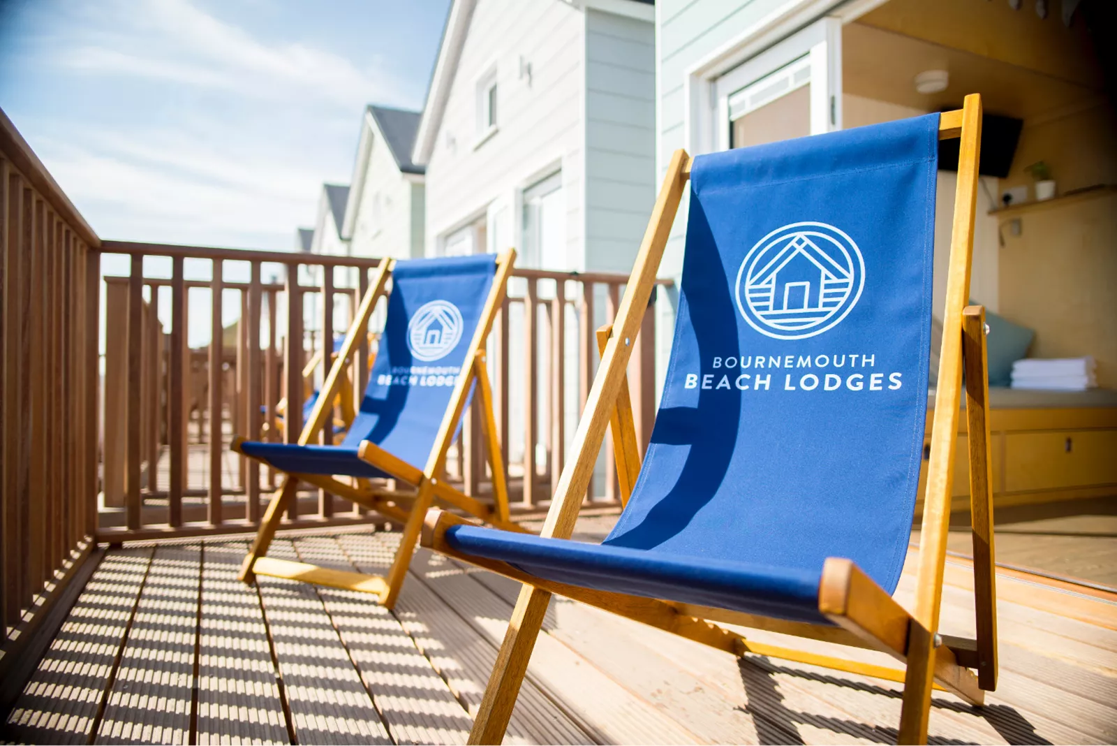 Two Bournemouth Beach Lodges deckchairs on decking