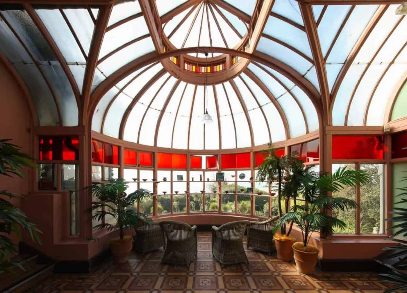 Red stained glass conservatory windows at the Russell-Cotes museum