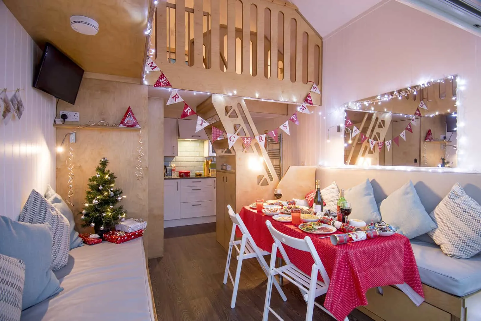 Christmas decoration fill a Beach Lodge with a table ready for guests to dine at