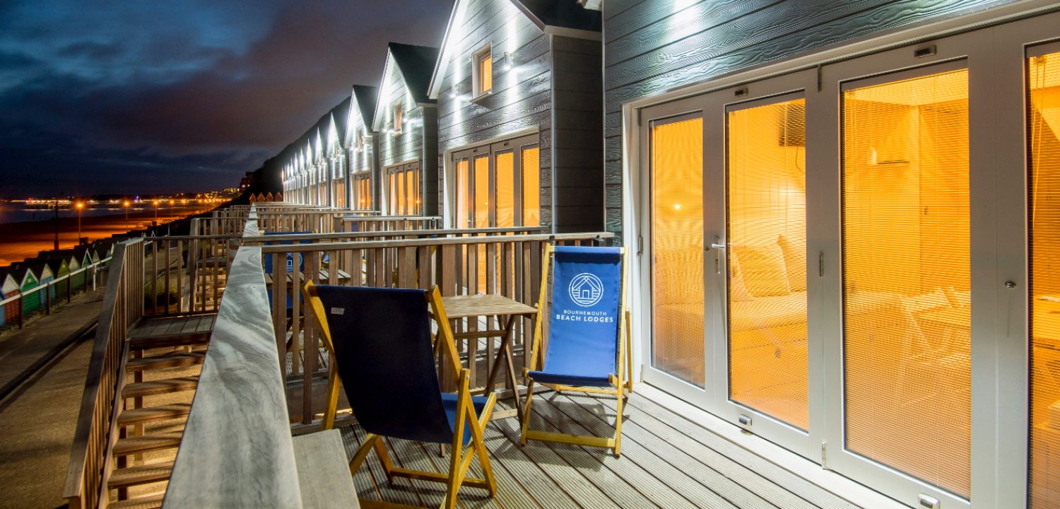 Outside view of the beach lodges lit up at night