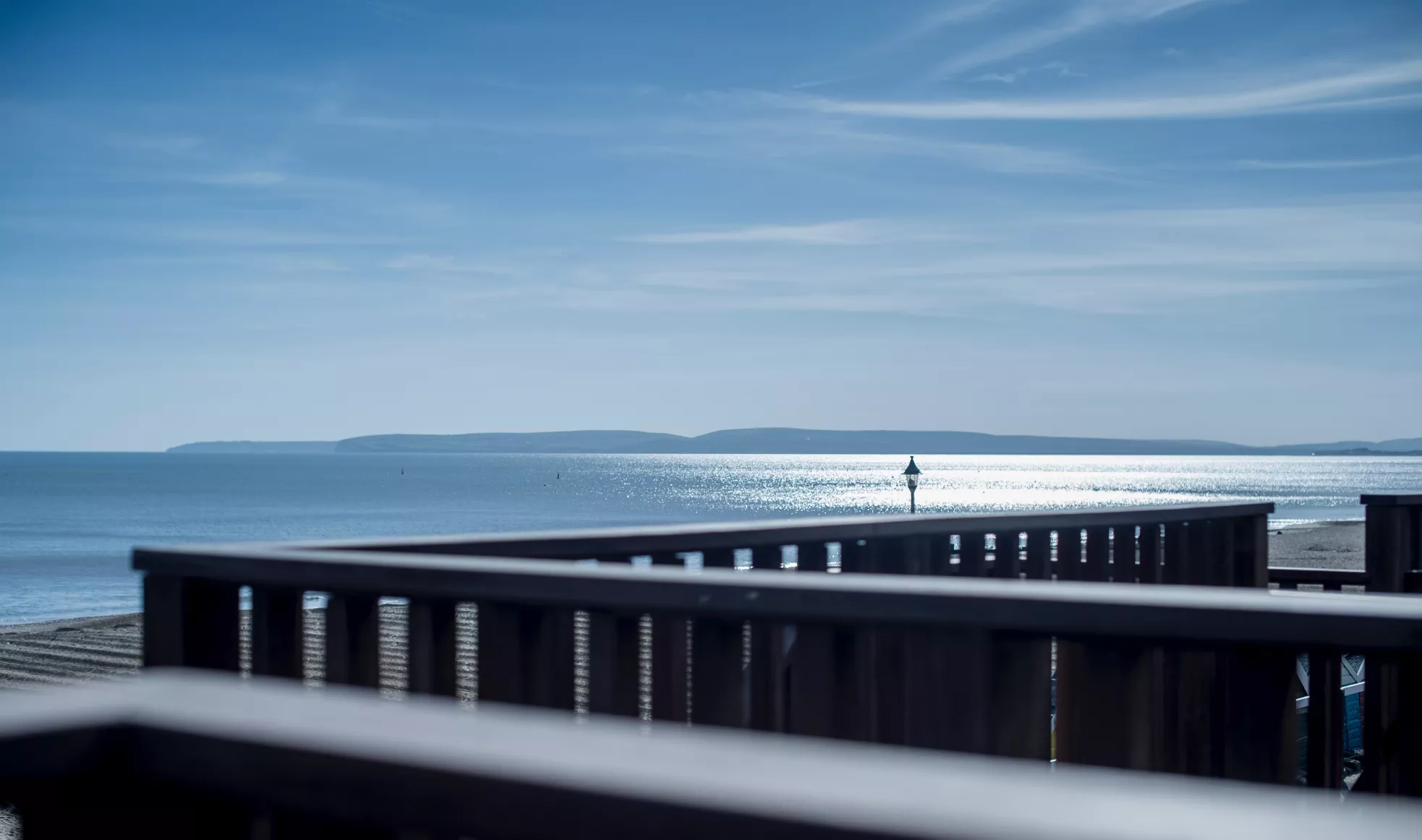 Very blue shot from the hut decks looking at the still sea and sky