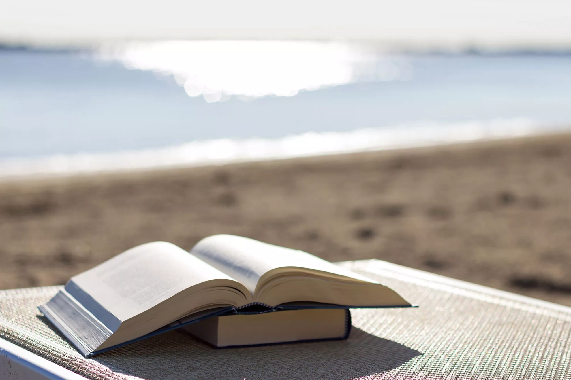 An open book on a beach