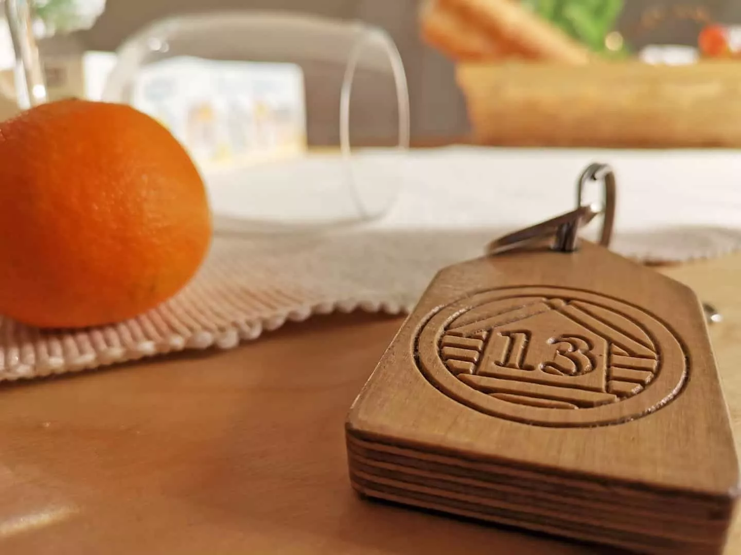 Close up of lodge 13 wooden key on a table
