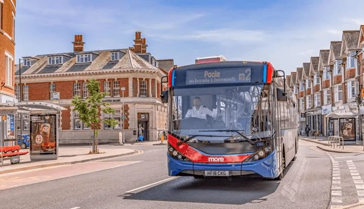 The bus driving off from the stop