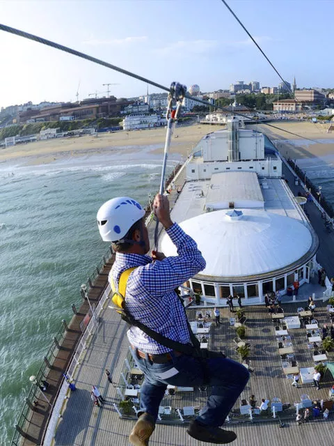 Guest zip lining from Bournemouth pier to the beach